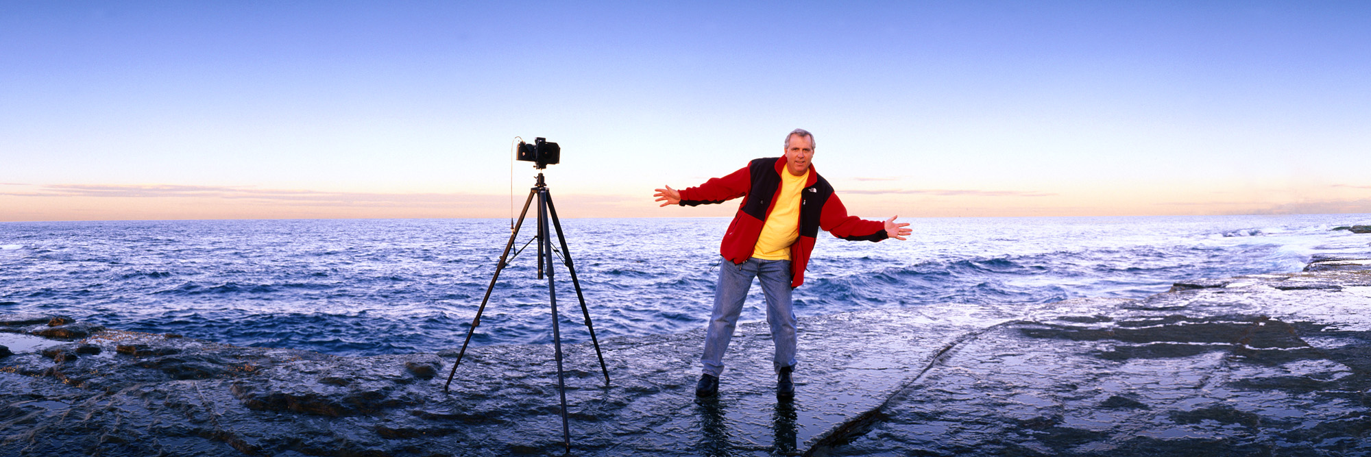 Ken Duncan photographing beside the ocean